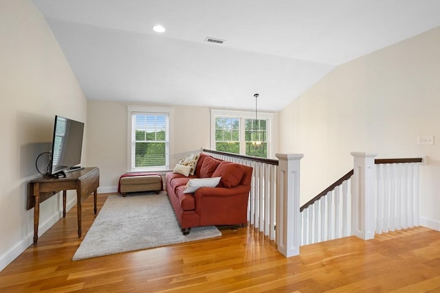 81 Hanover Rd, Carlisle, MA 01741 - living area with lofted ceiling, light wood finished floors, and baseboards