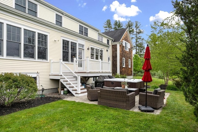 81 Hanover Rd, Carlisle, MA 01741 - rear view of house with a hot tub, a lawn, a patio area, and a deck