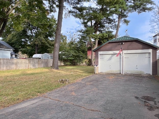 garage with a yard