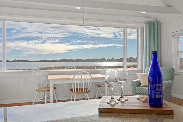 interior space featuring a water view and hardwood / wood-style flooring