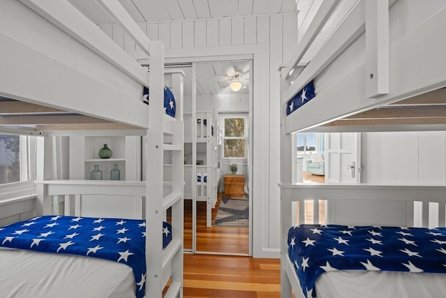 bedroom featuring wood-type flooring and a closet