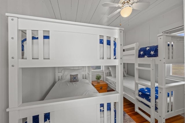 bedroom featuring ceiling fan, wooden ceiling, and wood-type flooring