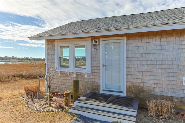 doorway to property featuring a water view