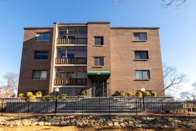 view of property with fence