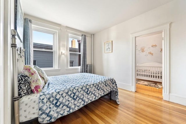 bedroom with hardwood / wood-style floors