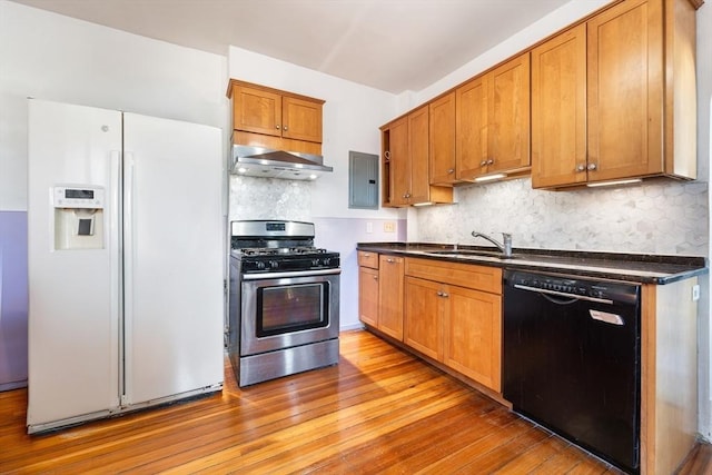 kitchen featuring sink, white fridge with ice dispenser, stainless steel gas range, black dishwasher, and backsplash