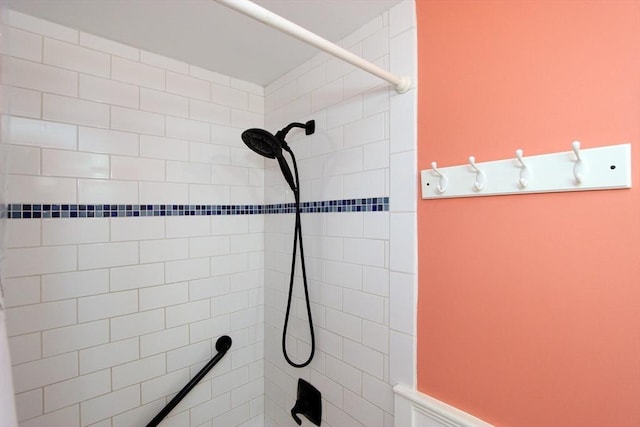 bathroom with a tile shower