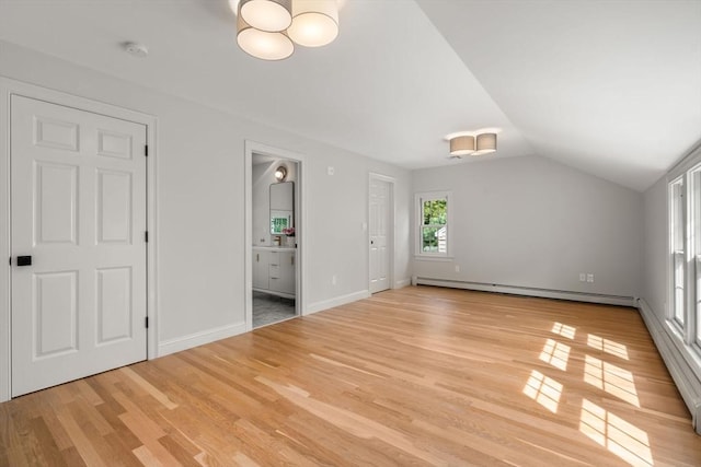 443 Great Plain Ave, Needham, MA 02492 - bonus room featuring a baseboard radiator, vaulted ceiling, light wood-style floors, and a chandelier