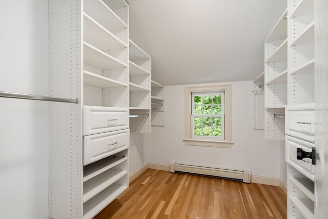 443 Great Plain Ave, Needham, MA 02492 - walk in closet with a baseboard heating unit and light wood-style flooring