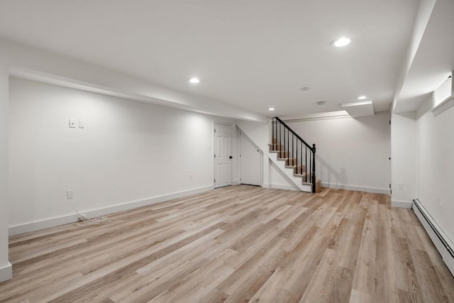 443 Great Plain Ave, Needham, MA 02492 - finished below grade area featuring baseboard heating, stairs, recessed lighting, light wood-type flooring, and baseboards