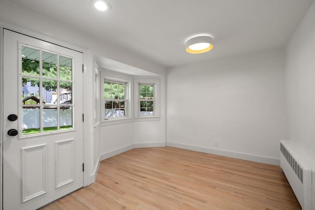 443 Great Plain Ave, Needham, MA 02492 - doorway to outside with radiator, plenty of natural light, light wood-style flooring, baseboards, and recessed lighting