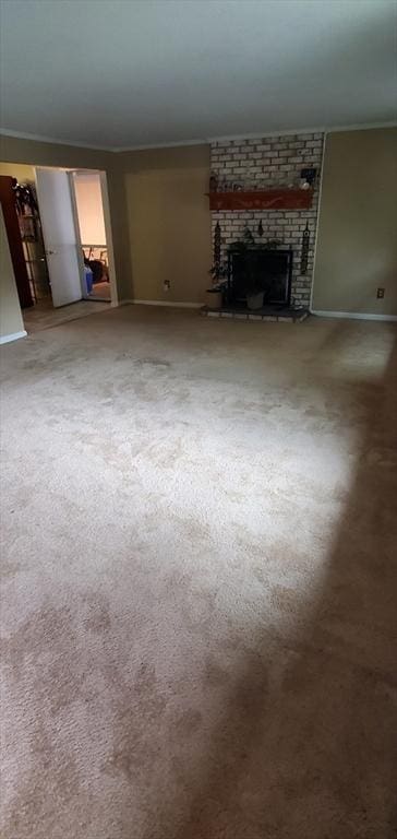 56 Granby Hts Unit 56, Granby, MA 01033 - unfurnished living room with a brick fireplace, baseboards, carpet floors, and crown molding