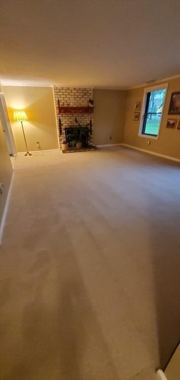 56 Granby Hts Unit 56, Granby, MA 01033 - unfurnished living room featuring carpet flooring, a fireplace, and baseboards