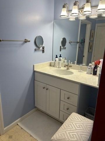 56 Granby Hts Unit 56, Granby, MA 01033 - bathroom with vanity and baseboards