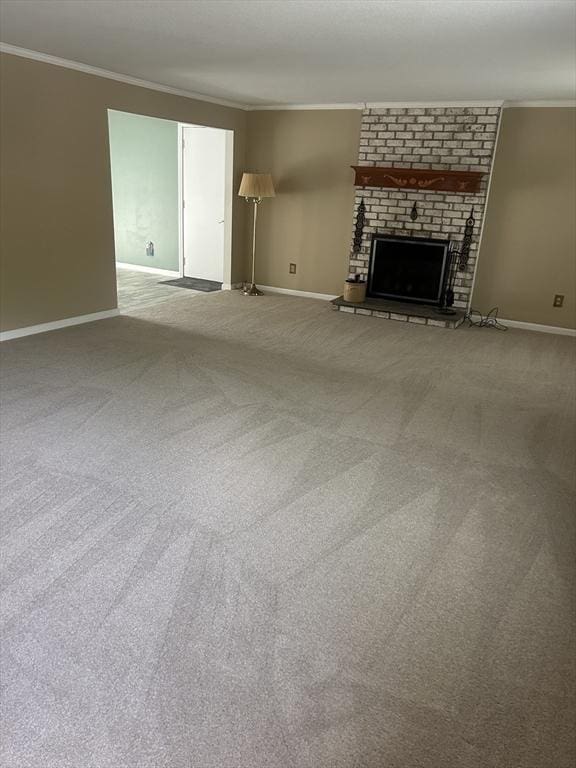 56 Granby Hts Unit 56, Granby, MA 01033 - unfurnished living room with crown molding, baseboards, carpet flooring, and a brick fireplace