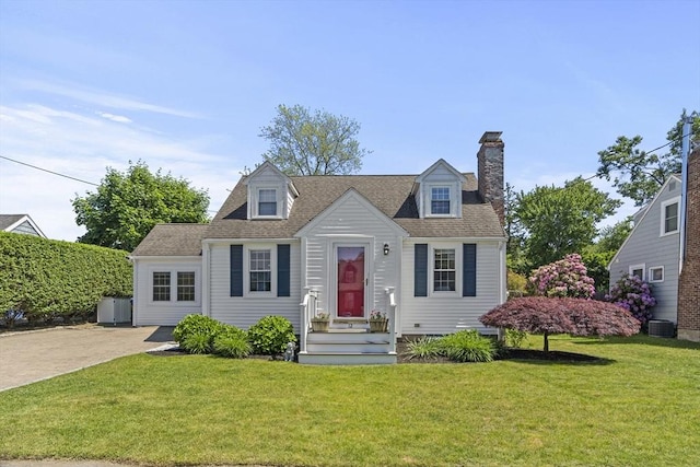 12 Willow St, Wakefield, MA 01880 - cape cod-style house with a front yard, a chimney, and a shingled roof