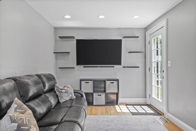 12 Willow St, Wakefield, MA 01880 - living room with wood finished floors, healthy amount of natural light, and recessed lighting