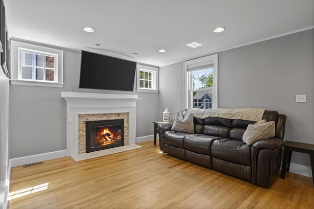 12 Willow St, Wakefield, MA 01880 - living area with light wood-type flooring, a fireplace, recessed lighting, and ornamental molding