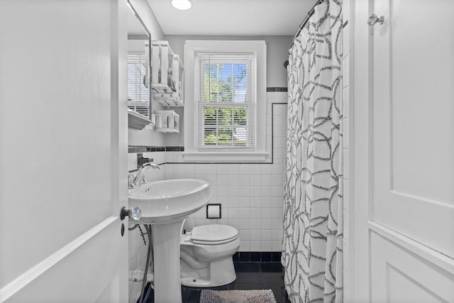 12 Willow St, Wakefield, MA 01880 - bathroom featuring tile walls, tile patterned floors, a wainscoted wall, and curtained shower