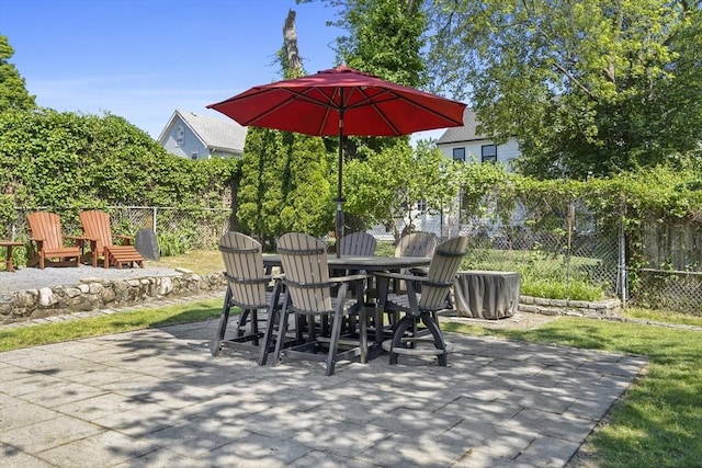 12 Willow St, Wakefield, MA 01880 - fenced backyard featuring a patio and outdoor dining space
