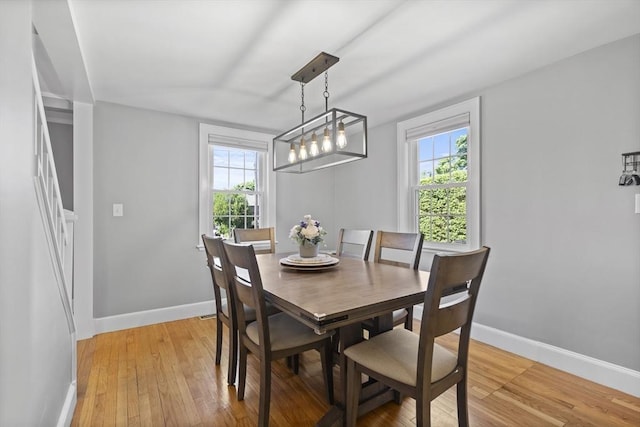 12 Willow St, Wakefield, MA 01880 - dining room featuring baseboards and light wood-type flooring