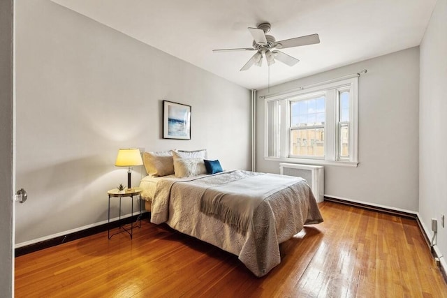 3 Arlington St Unit 31, Cambridge, MA 02140 - bedroom featuring radiator heating unit, hardwood / wood-style floors, baseboards, and ceiling fan
