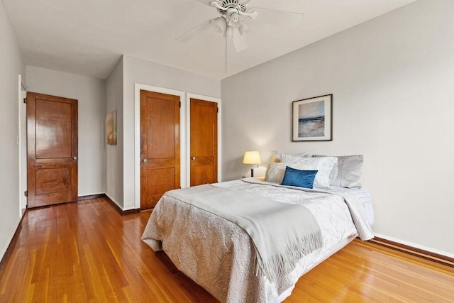 3 Arlington St Unit 31, Cambridge, MA 02140 - bedroom with baseboards, wood finished floors, a ceiling fan, and a closet