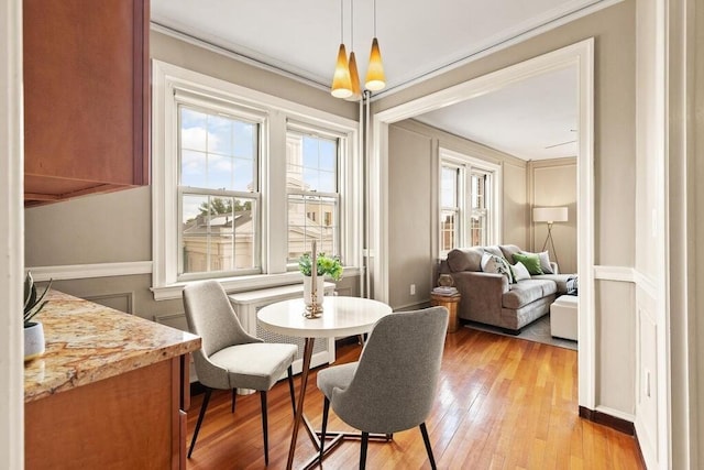 3 Arlington St Unit 31, Cambridge, MA 02140 - dining area featuring light wood-style floors and crown molding