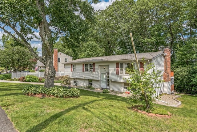 163 Lockland Ave, Framingham, MA 01701 - split foyer home featuring a chimney and a front yard