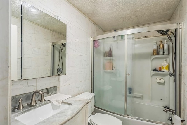 163 Lockland Ave, Framingham, MA 01701 - full bath featuring toilet, a textured ceiling, vanity, enclosed tub / shower combo, and decorative backsplash