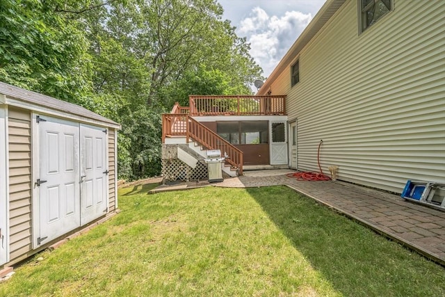 163 Lockland Ave, Framingham, MA 01701 - view of green lawn with stairs, a deck, and a patio area
