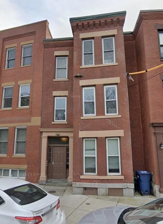 view of front of home with brick siding