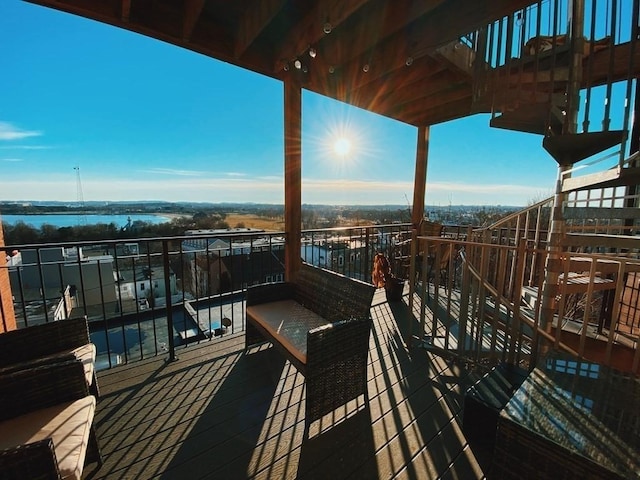 balcony featuring a water view