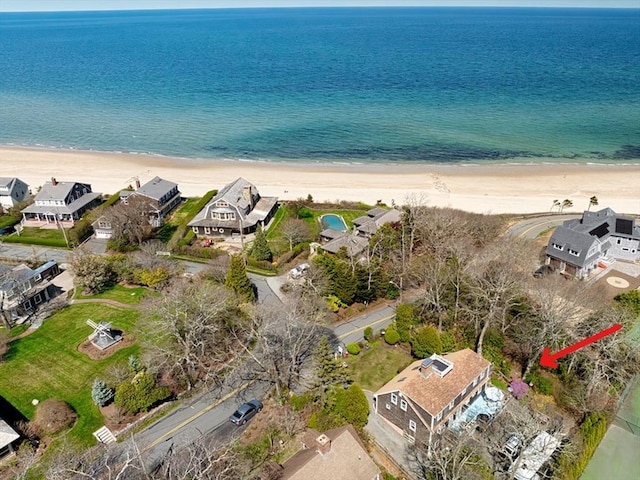 aerial view with a water view, a residential view, and a view of the beach