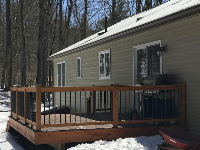 view of snow covered deck