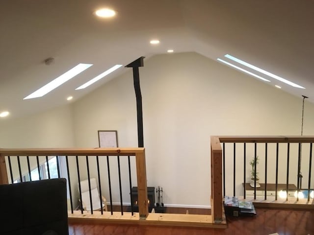 additional living space featuring vaulted ceiling and recessed lighting