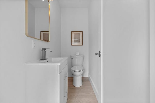 30A Emerald Rd Unit A, Nahant, MA 01908 - bathroom with wood finished floors, baseboards, vanity, and toilet