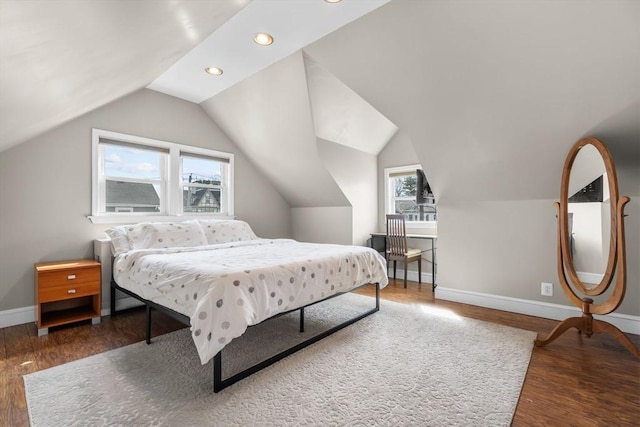 bedroom featuring baseboards, recessed lighting, lofted ceiling, and wood finished floors