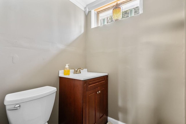 half bathroom featuring vanity and toilet