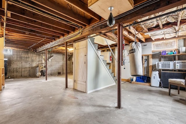 unfinished basement featuring stairs