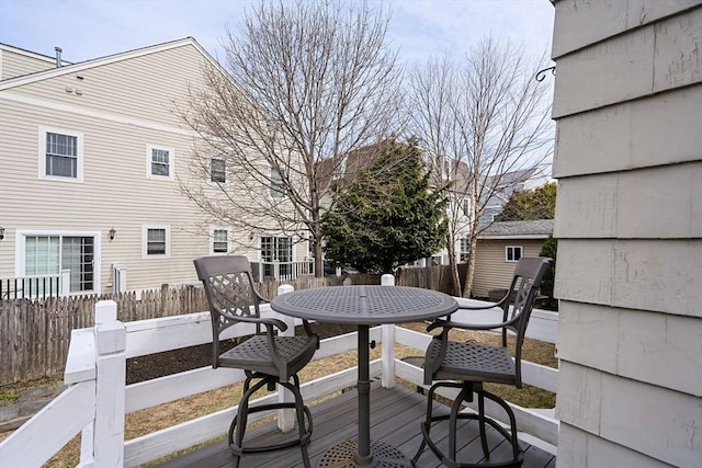 wooden deck featuring fence and outdoor dining area