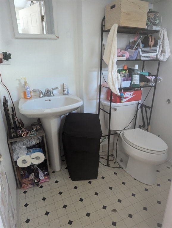 bathroom with toilet and sink