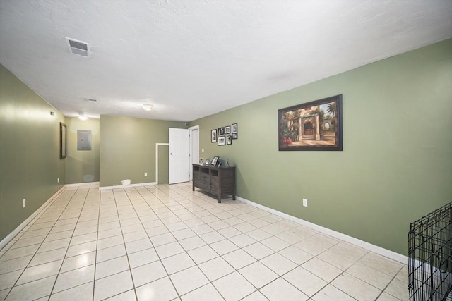 12 Wilson St, Randolph, MA 02368 - empty room with electric panel and light tile patterned flooring