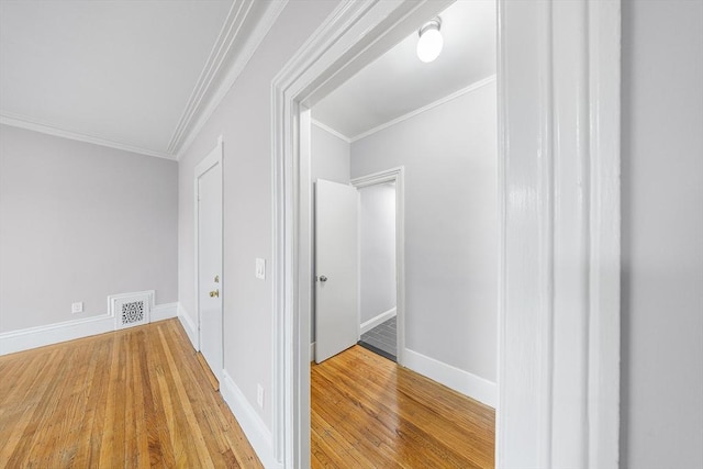 100 Charles St Unit 5, Boston, MA 02114 - corridor featuring wood-type flooring, ornamental molding, and attic access