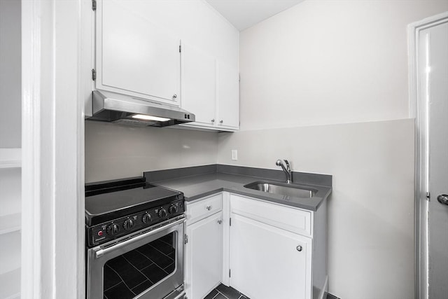 100 Charles St Unit 5, Boston, MA 02114 - kitchen with electric range, under cabinet range hood, white cabinetry, and dark countertops