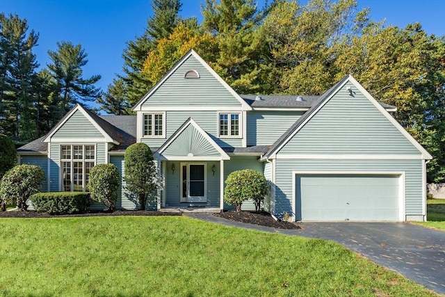 view of front property featuring a front yard and a garage