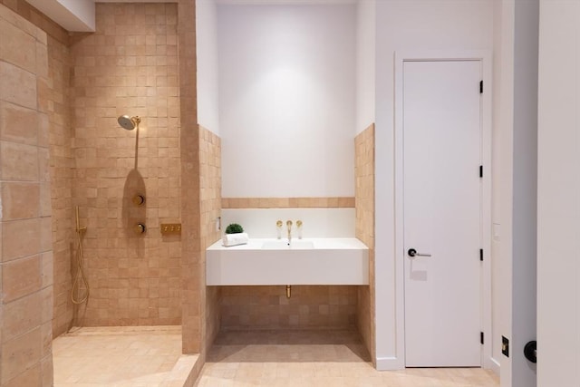 bathroom with a tile shower