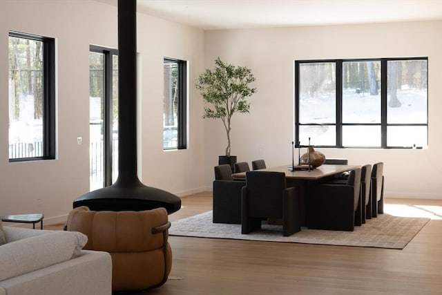 dining area with wood finished floors and baseboards