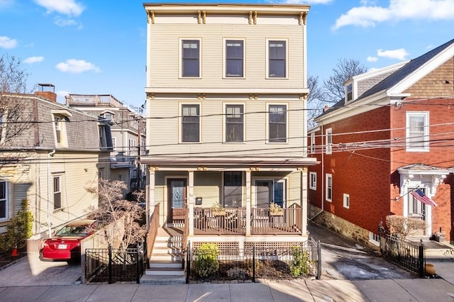 italianate-style house featuring a porch