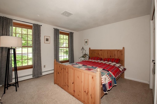 carpeted bedroom with baseboards